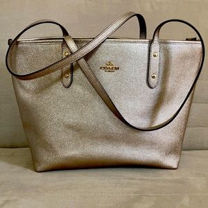 Ladies gold colored Coach Tote with zipper closure